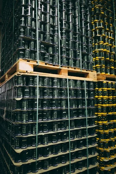 Palletized cans stacked in warehouse storage
